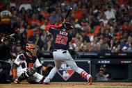 Juan Soto hits a solo home run against the Houston Astros during the fourth inning in Game One of the 2019 World Series at Minute Maid Park on October 22, 2019
